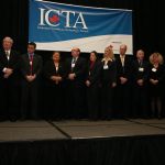 The nine 2012 ICTA finalists, and group members, assemble on stage.